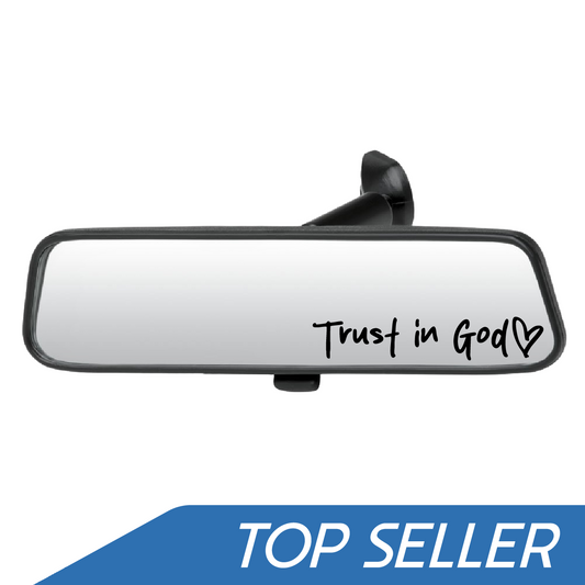 Car rearview mirror with 'Trust in God' text on a white background