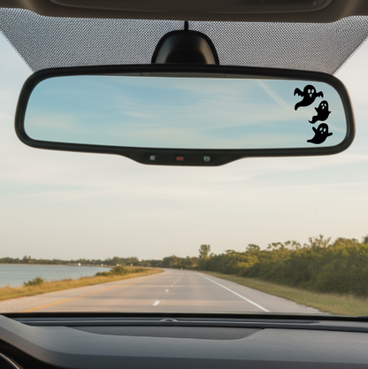 Car interior with a rearview mirror and road ahead view