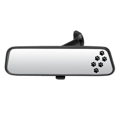 Car rearview mirror with black paw prints on a white background