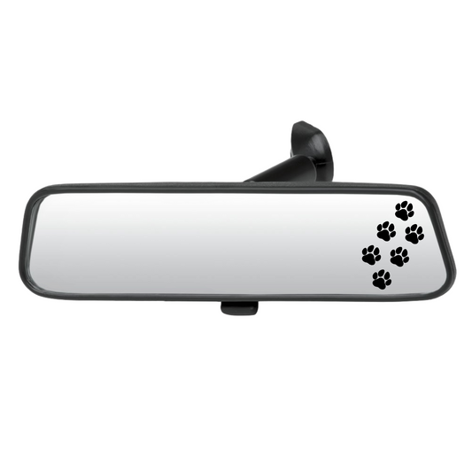 Car rearview mirror with black paw prints on a white background