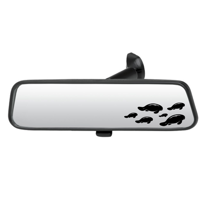 Car rearview mirror with manatee decals on a white background
